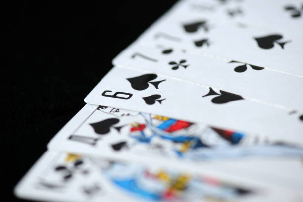 istock Playing cards on a dark background close up 1036841584