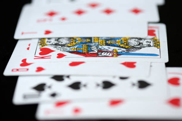 istock Playing cards on a dark background close up 1036841632