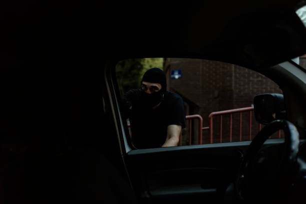 istock Car Burglar in the Action 1036851206