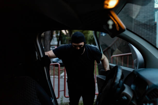 istock Car Burglar in the Action 1036851238