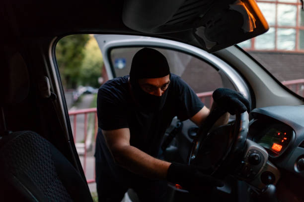 istock Car Burglar in the Action 1036851256