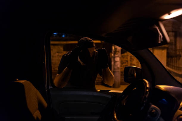 istock Car Burglar in the Action 1036851388