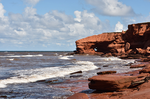 Rugged panoramic scenes of the red cliffs and beaches of Cavendish, Prince Edward Island, Canada. This land is rural and largely untouched.  The National Park protects the sand dunes and other natural features of this beautiful ecosystem.