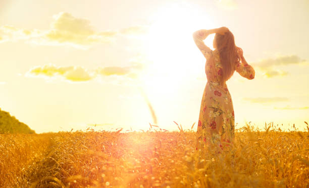 istock Young girl in wheat field 1036870046