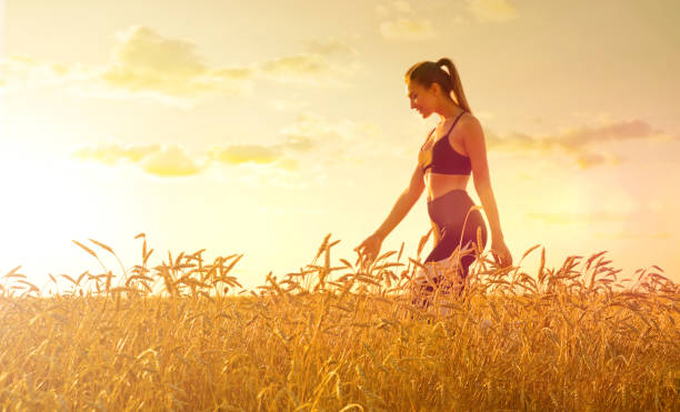 istock Young girl in wheat field 1036870094