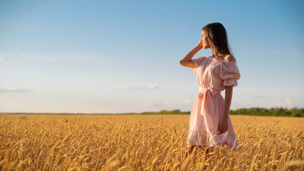 istock Young girl in wheat field 1036870154