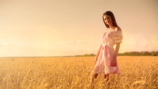 istock Young girl in wheat field 1036870168
