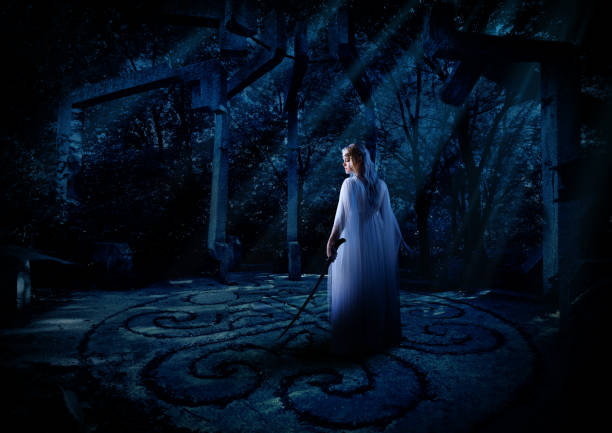 istock Elven girl in night forest 1036870178