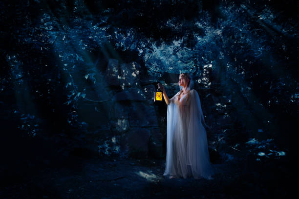 istock Elven girl in night forest 1036870212