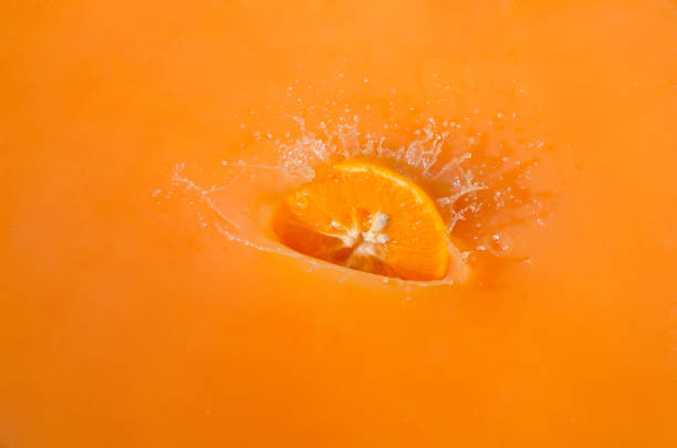 istock fresh orange juice with fresh fruits on water 1036873504