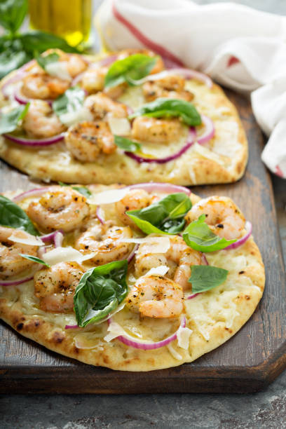 istock Flatbread with cheese and garlic shrimp 1036880012