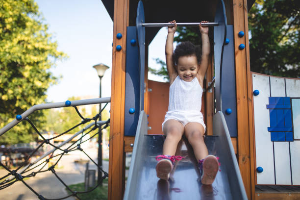 istock Lovely mixed race toddler playing on a playground 1036880108