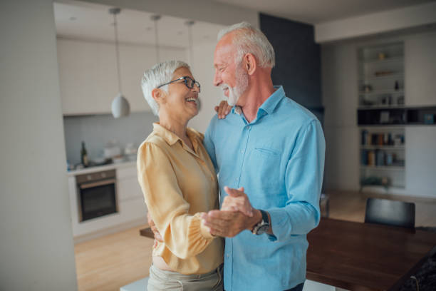 istock Couple dancing at home 1036880608
