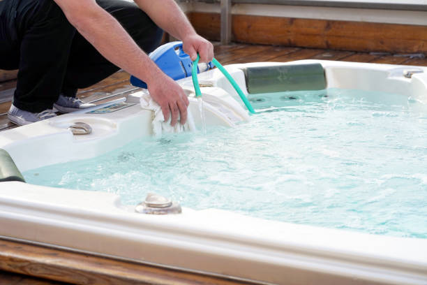 istock Hotel staff worker cleaning the pool 1036887694