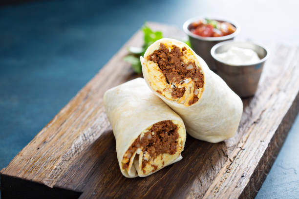 Breakfast burrito with chorizo and egg Breakfast burrito with spicy chorizo and egg burrito stock pictures, royalty-free photos & images