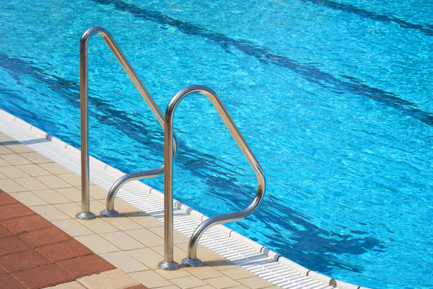 istock Hotel staff worker cleaning the pool 1036898042