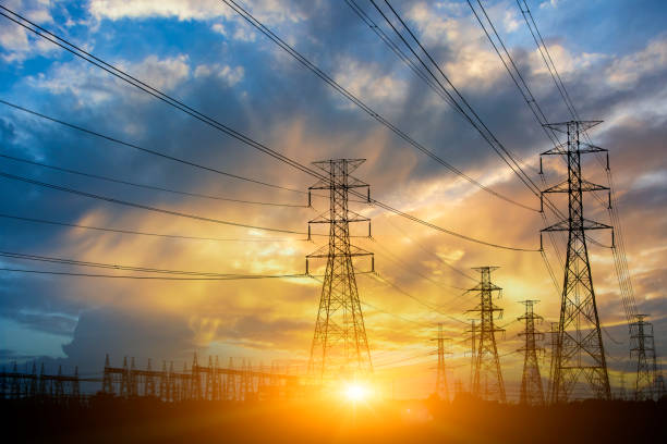 istock Silhouette High voltage electric tower on sunset time and sky on sunset time background. 1036899684