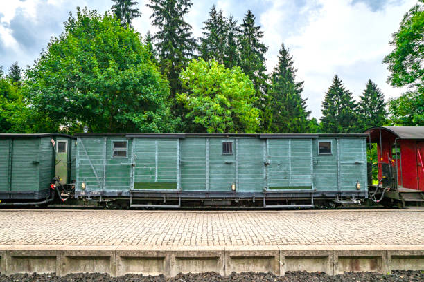 istock Train wagon with cargo on a railway at a station 1036906908