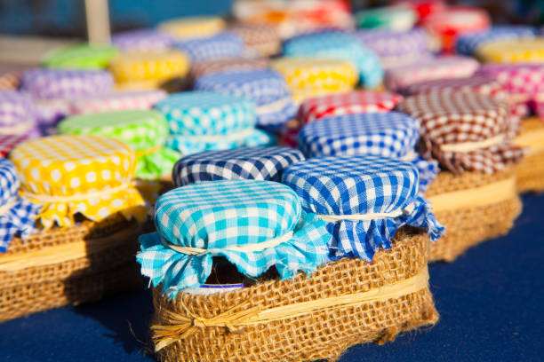 istock Many jam jurs with colored cloths on lids 1036909748