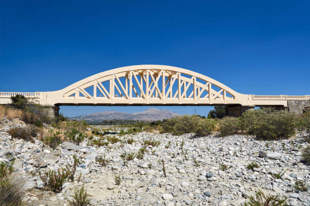 istock A road arched bridge over a dried river 1036911390