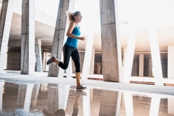 istock Woman running outdoors 1036911914