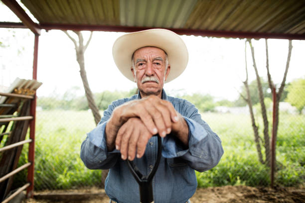 Smiling old man walking with a cane