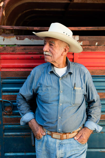istock Senior mexican man standing with hands in pockets 1036925526
