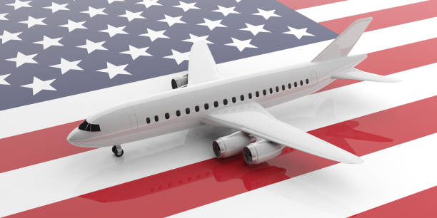 istock Airplane on USA flag background, view from above. 3d illustration 1036926312