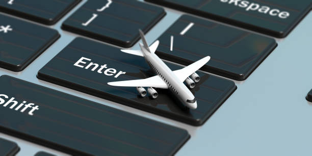 istock Online booking. Airplane on a computer keyboard, above view. 3d illustration 1036926342
