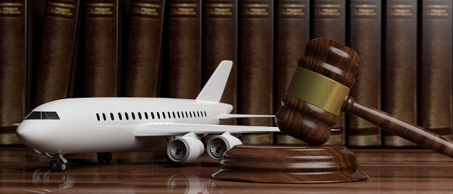 Aviation Law concept. Blank commercial airplane and judge gavel on legal books background. 3d illustration