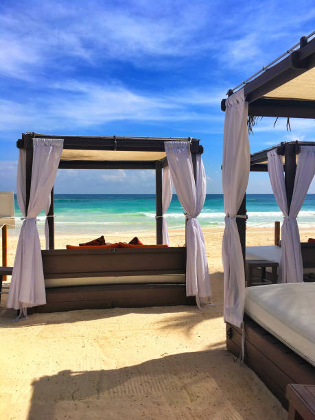 istock Luxury deck chairs on the beach in Playa de Carmen 1036927060