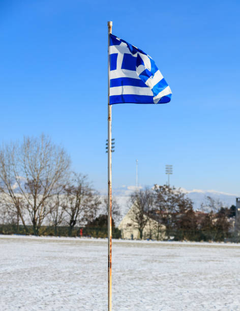 istock Greek flag waving in the blue sky 1036930588