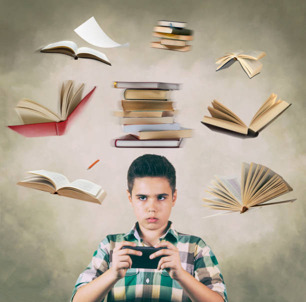 boring homework pictures It's better to play than to read a book Creative composite image of 12 year boy who is playing mobile game and ignoring doing homework. A lot of books are flying around his head. He feels guilty, he is aware of how much he has to read, but it's better to play a game. boring homework twelve stock pictures, royalty-free photos & images
