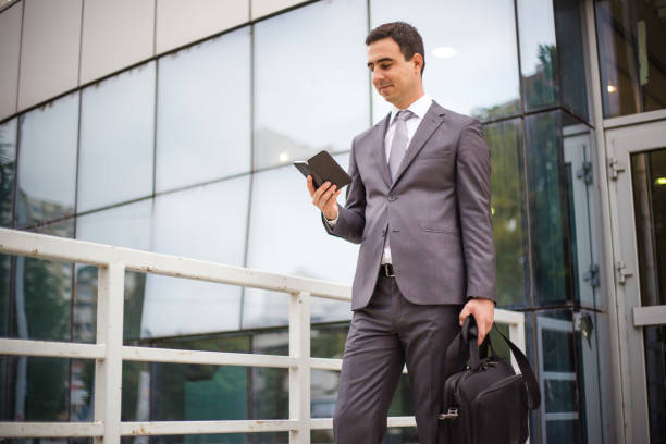 istock Young businessman using mobile phone 1036945422