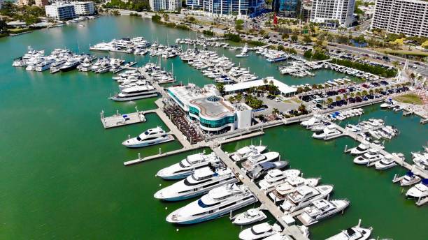 Aerial view of luxury yachts and pleasure craft in port - Sarasota, Florida Yachts of all shapes and sizes line Sarasota Harbor marina photos stock pictures, royalty-free photos & images