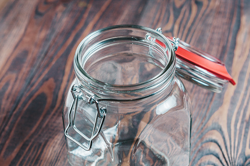 Empty glass jar with a hinged lid - dishes for food
