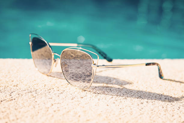 istock Sunglasses on the beach - vacation 1036964786