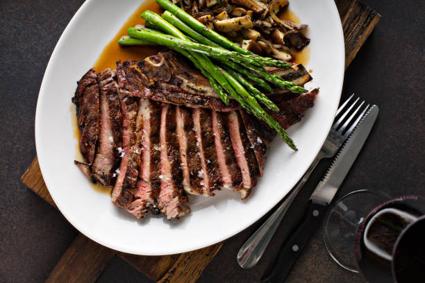 istock Beef steak with asparagus and mushrooms 1036965636