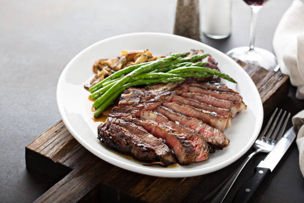 istock Beef steak with asparagus and mushrooms 1036965652