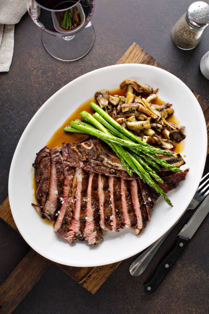 istock Beef steak with asparagus and mushrooms 1036965666
