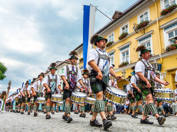 pageant in murnau - germany Murnau, Germany - July 8: traditionally dressed bavarians during the parade for the 73rd gaufest in the old town of murnau, germany on july 8, 2018 murnau photos stock pictures, royalty-free photos & images