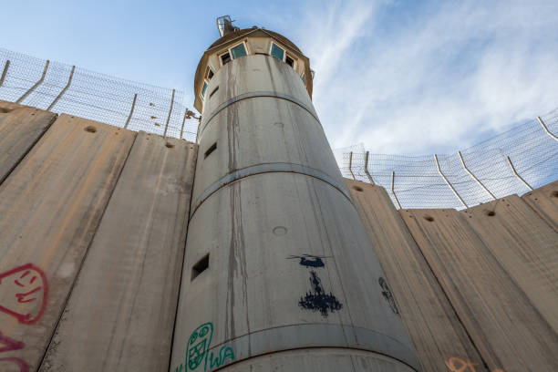 The Israeli West Bank barrier or wall Bethlehem: The Israeli West Bank barrier or wall circa May 2018 in  Bethlehem. banksy stock pictures, royalty-free photos & images