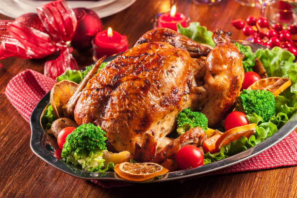 istock Baked or roasted whole chicken on Christmas table 1036980350