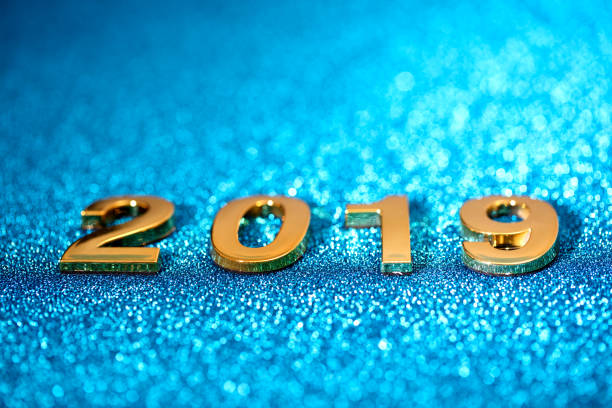 istock Golden New Year 2019 on a sparkling bokeh background (blue) 1036980780