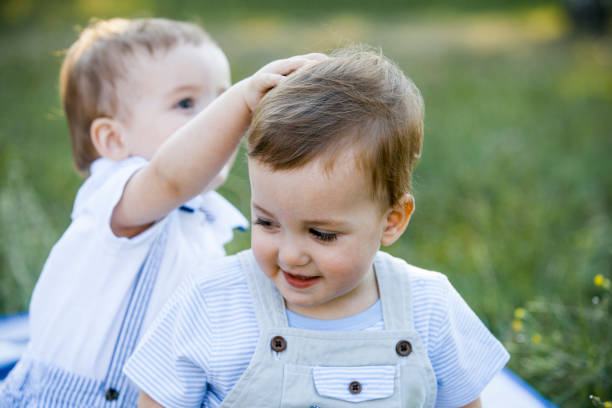 istock Cute Twin Brothers Outside 1036984642