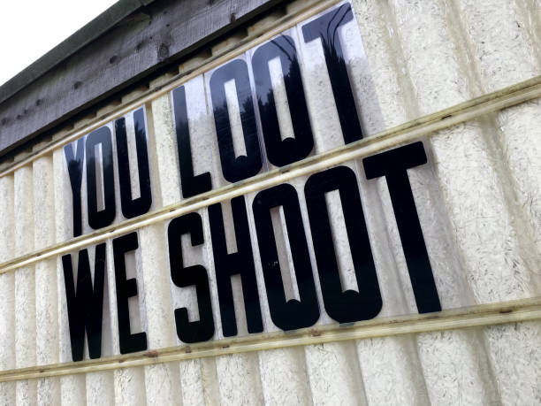 istock Loot We’ll Shoot Warning Sign for Hurricane Florence 2018 1036985744