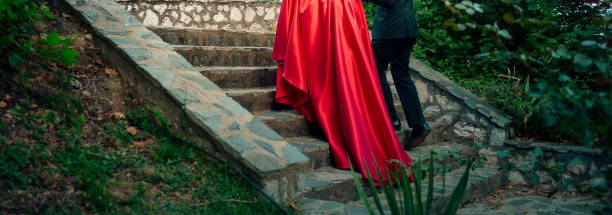 istock unrecognizable bride and groom on a stone stairs 1036988924