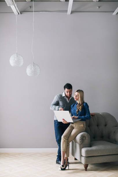 istock Man and a woman with a laptop 1036994902