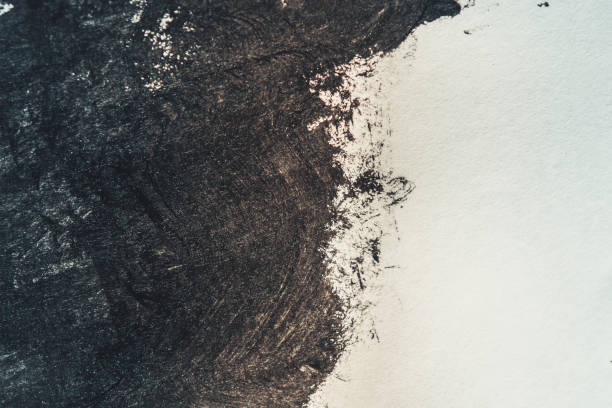 Strokes of black paint on a white background