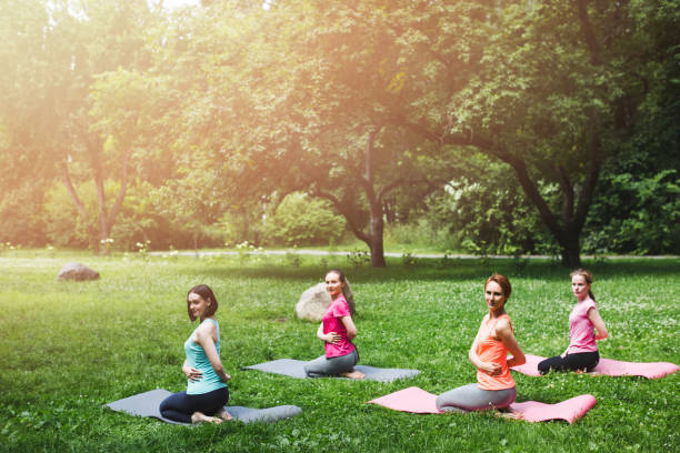 istock Women making yoga exercises in the fresh air sunlight effect 1036995630